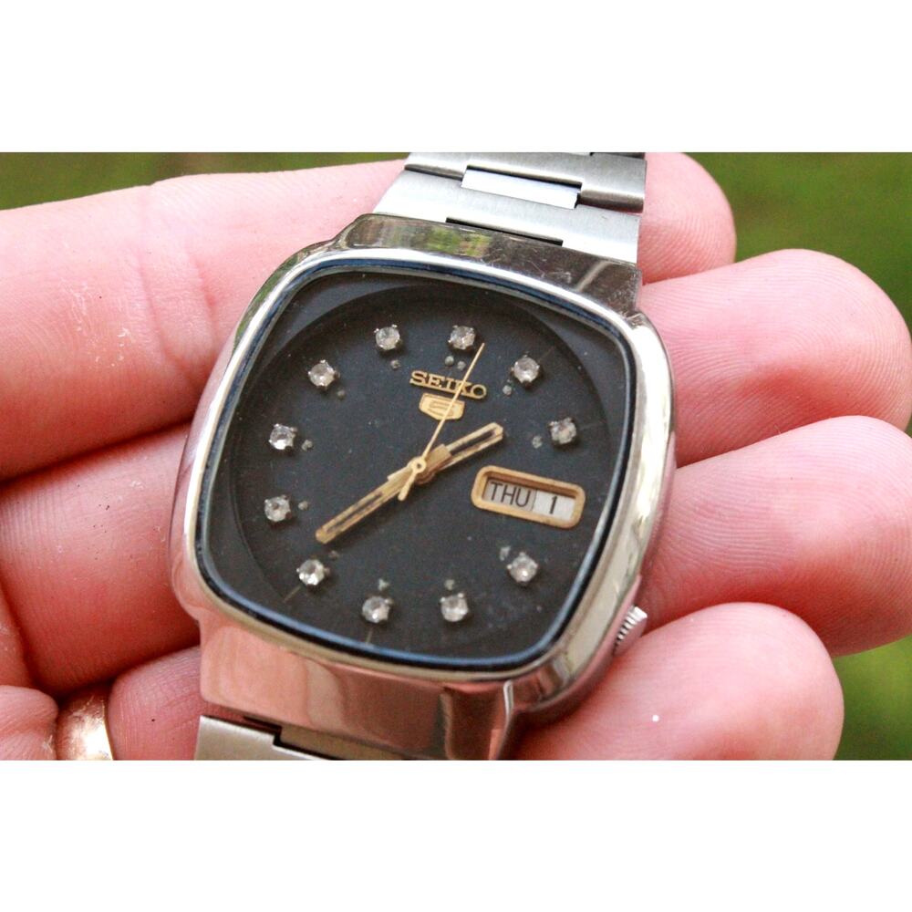 Seiko Men's Silver Stainless Steel Watch with Black Dial and Gold Accents